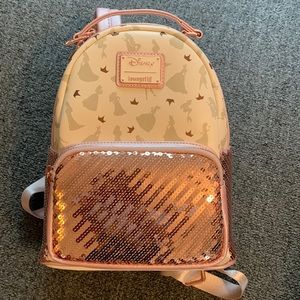 Disney small backpack. Cream and pink with the design of princesses